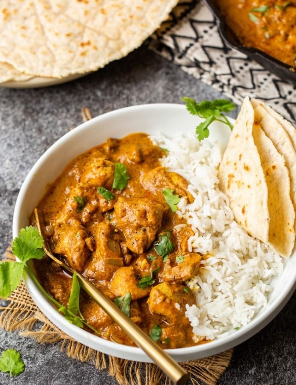Butter Chicken Pumpkin Curry in a bowl with naan