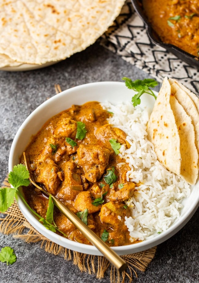 Butter Chicken Pumpkin Curry in a bowl with naan