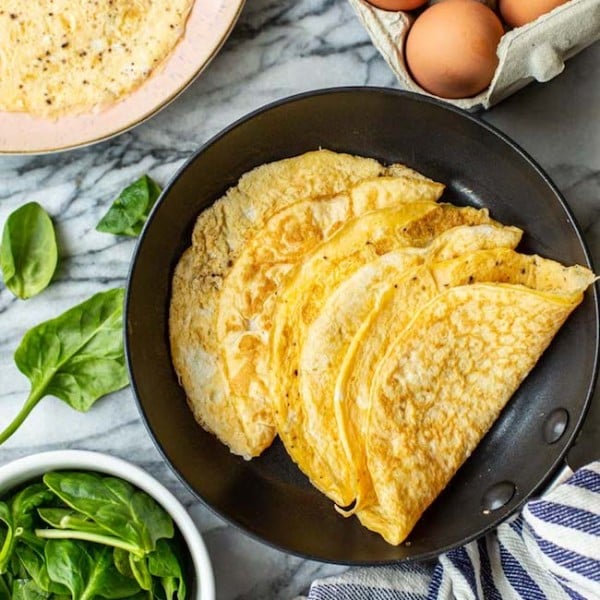 Keto egg wraps folded in a pan