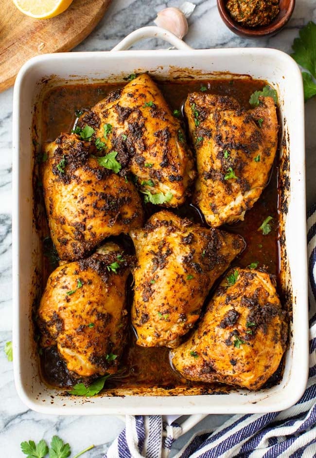 baked chermoula chicken in a baking dish