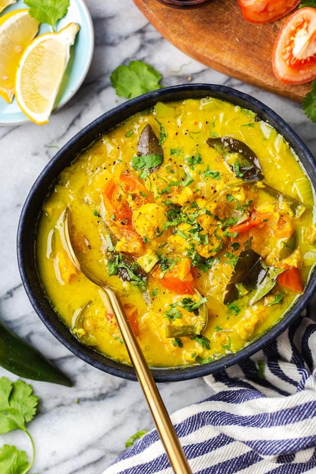 fish molee in a blue bowl 