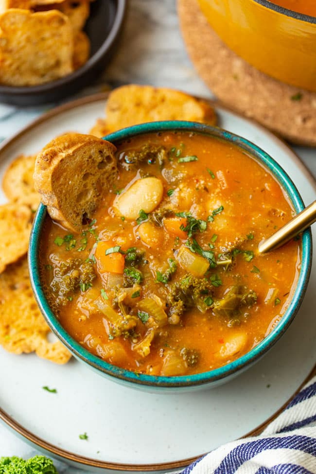 a bowl of Tomato-y & Kale White Bean Soup 