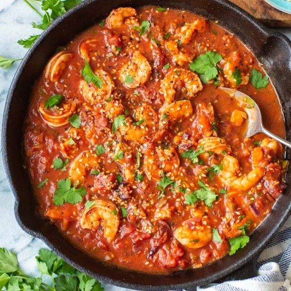 Mediterranean Shrimp Stew with a serving spoon