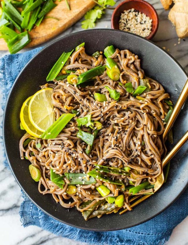 Spring Onion Peanut Noodles in a black bowl