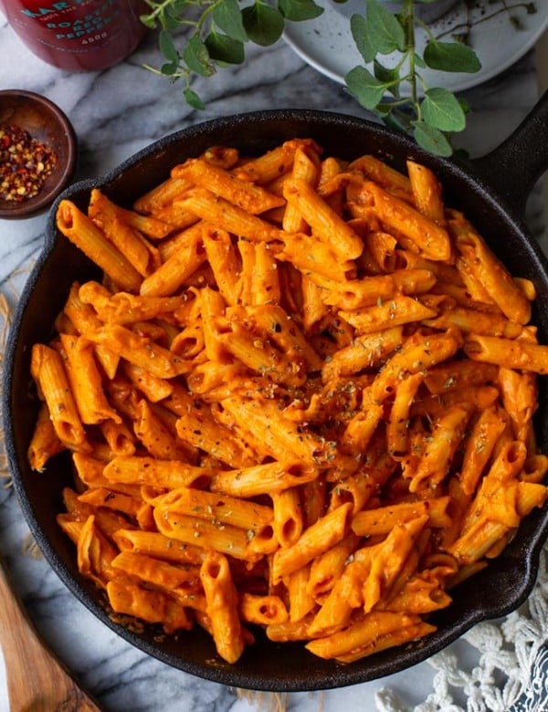 Creamy Roasted Red Pepper Vegan Pasta in a cast iron skillet