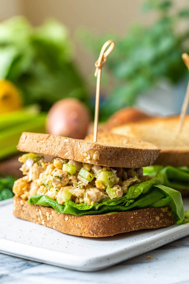 Smashed Chickpea Salad sandwich on a white plate