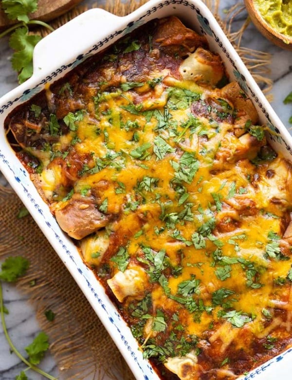 gluten free enchiladas topped with cheese and cilantro