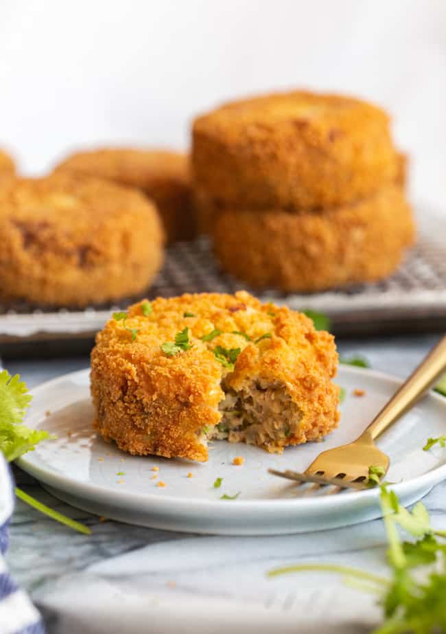 Gluten Free Salmon Cakes on a plate with a bite taken out 