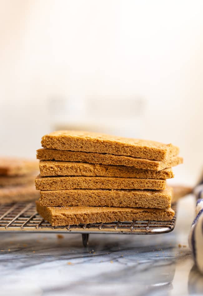 Gluten Free Graham Crackers stacked on a wire cooling rack