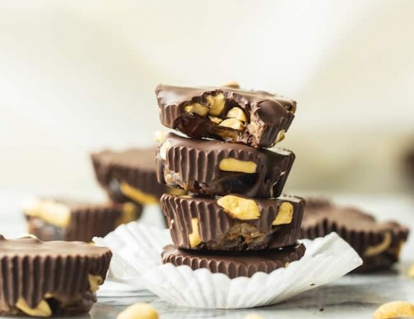a small stack of three Caramel-y Peanut Chocolate Cups