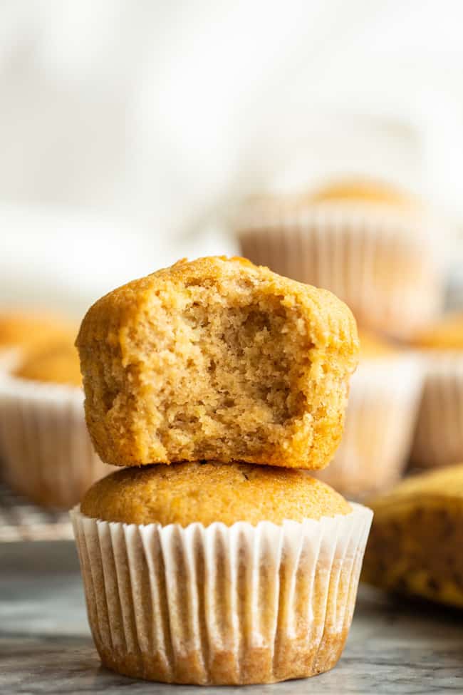 Gluten Free Banana Muffins stacked with a bite taken out