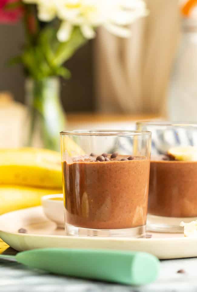 two glasses of Chocolate Peanut Butter Chia Pudding on a plate