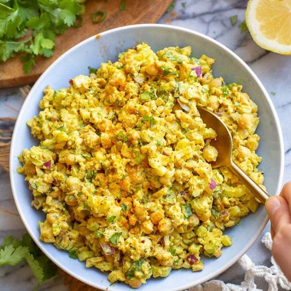 curried chickpea salad in a blue bowl