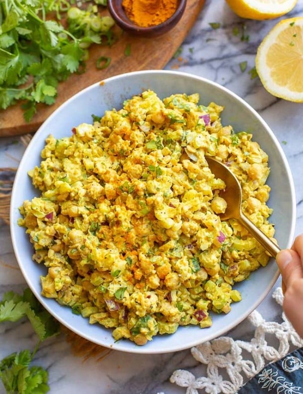 curried chickpea salad in a blue bowl