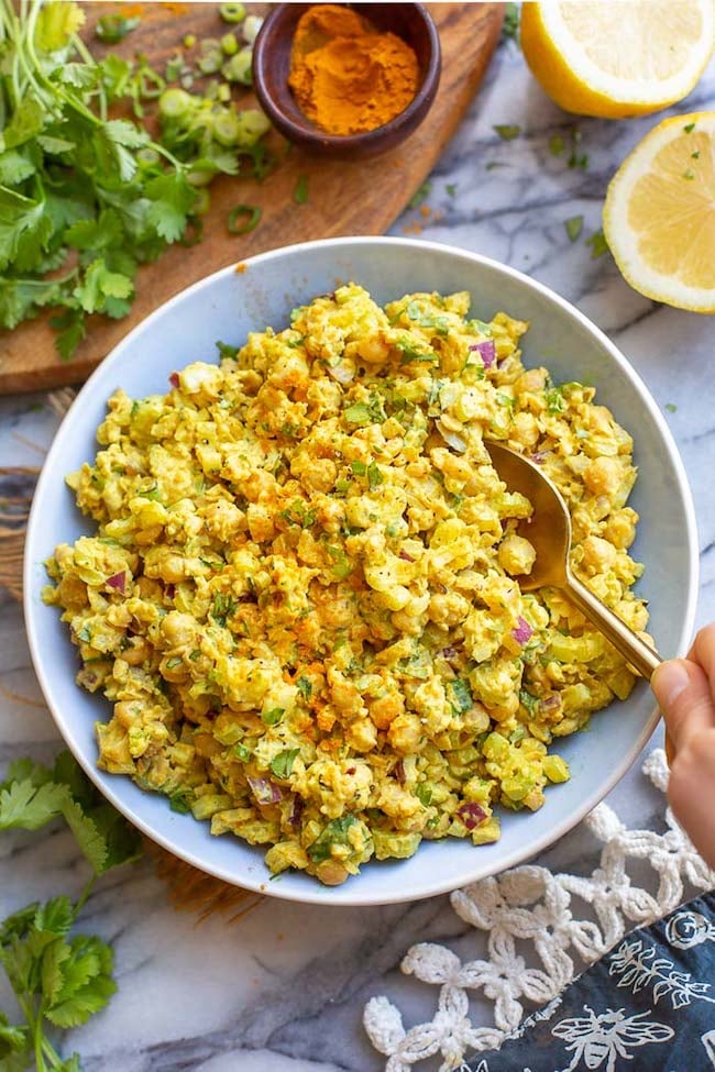 curried chickpea salad in a blue bowl