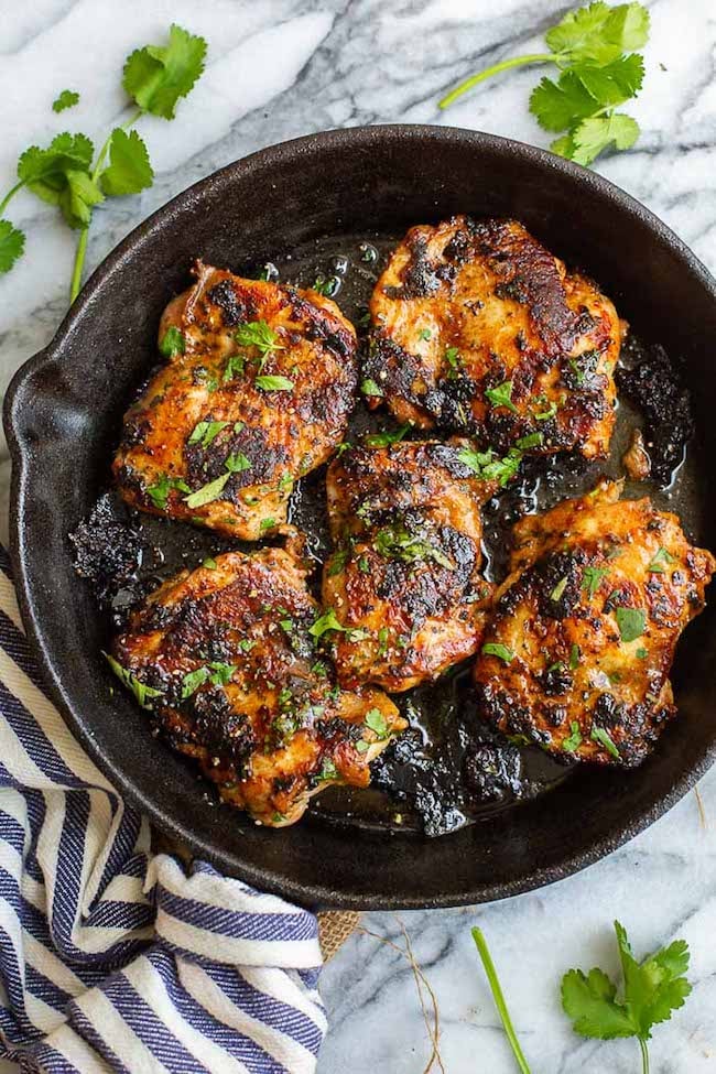 Ping Gai Chicken in a cast iron skillet