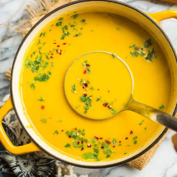 Curried-Butternut-Squash-Soup in a pot with a soup ladle