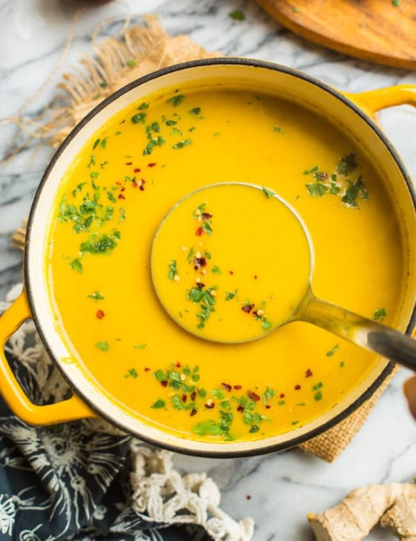 Curried-Butternut-Squash-Soup in a pot with a soup ladle
