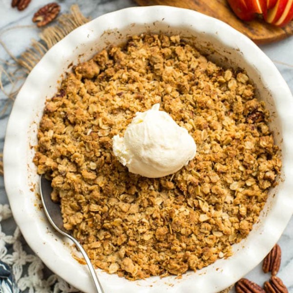 Gluten-Free-Apple-Crisp in a baking dish with ice cream