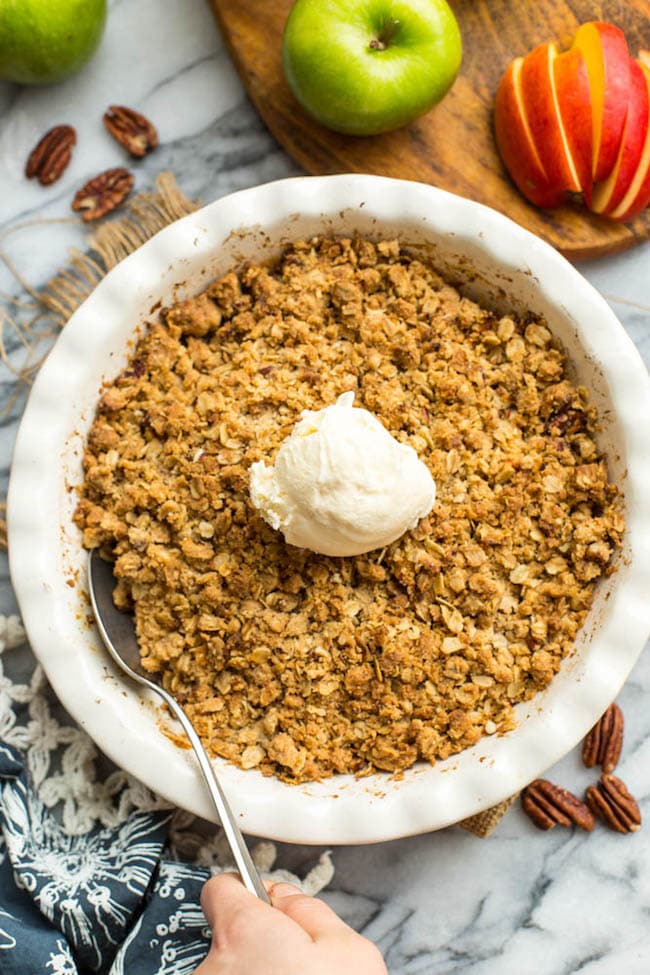 spoon scooping out from a Gluten Free Apple Crisp