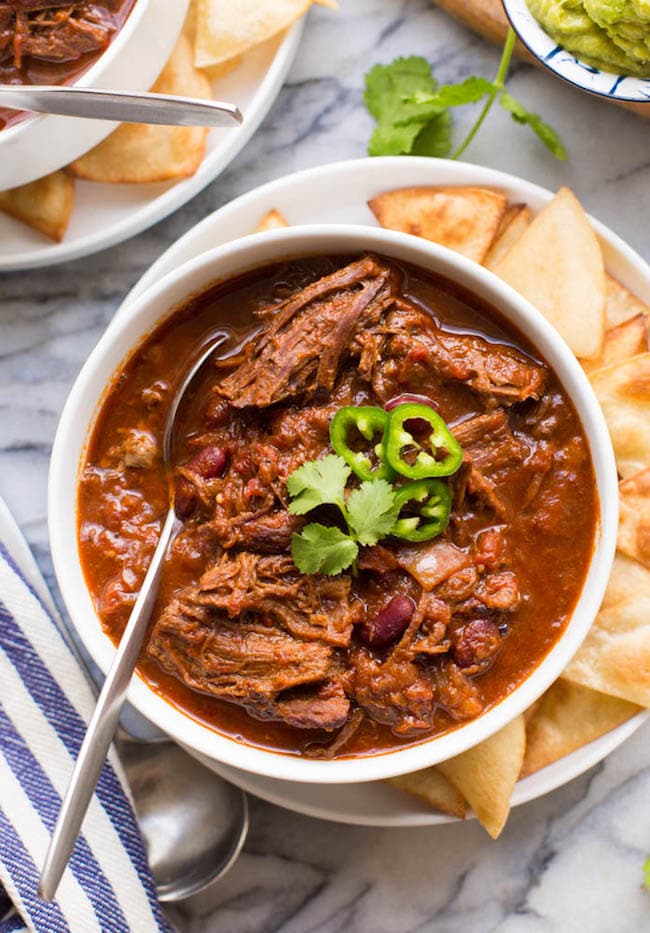 Instant Pot Chili Con Carne with Shredded Beef in a bowl topped with chilies