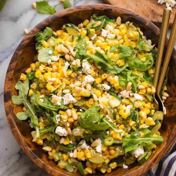 Sautéed Corn & Courgette Salad in a wooden salad bowl