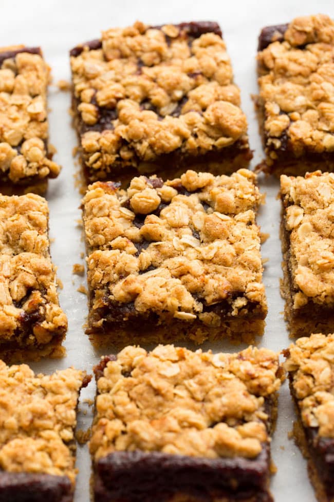 gluten free date squares cut up on a baking sheet
