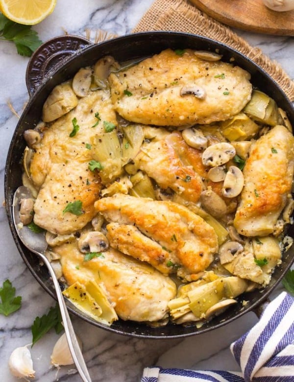 mushroom artichoke chicken in a cast iron skillet