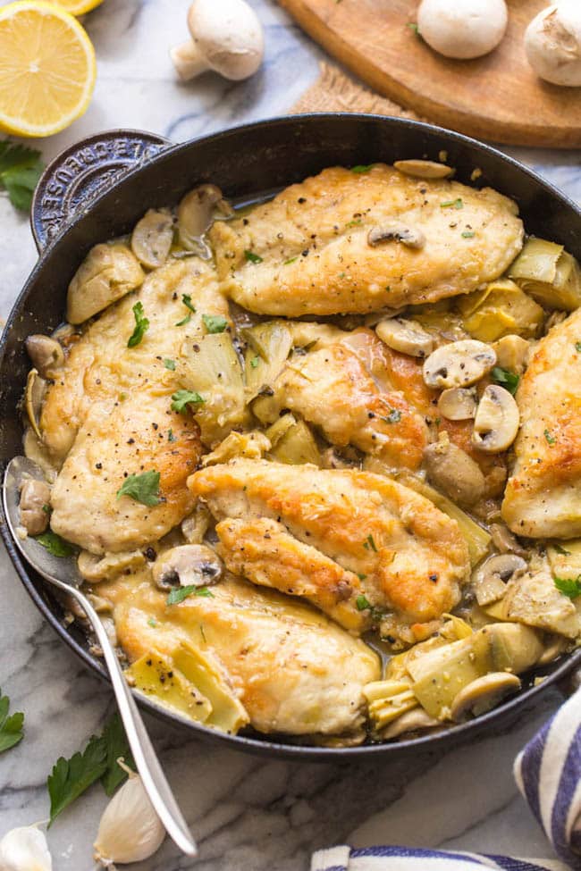 skillet containing mushroom & artichoke chicken