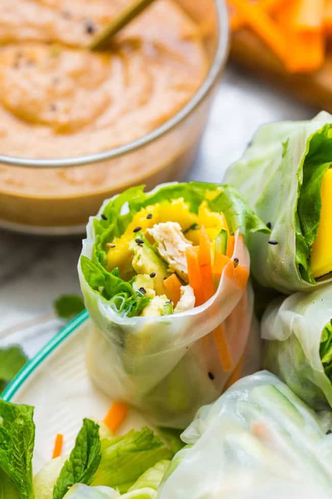 summer rolls cut in half sprinkled with black sesame seeds