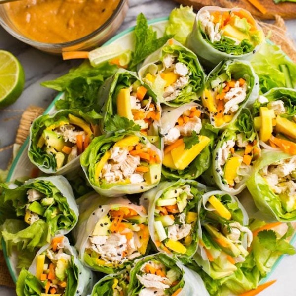 summer rolls cut in half on a platter