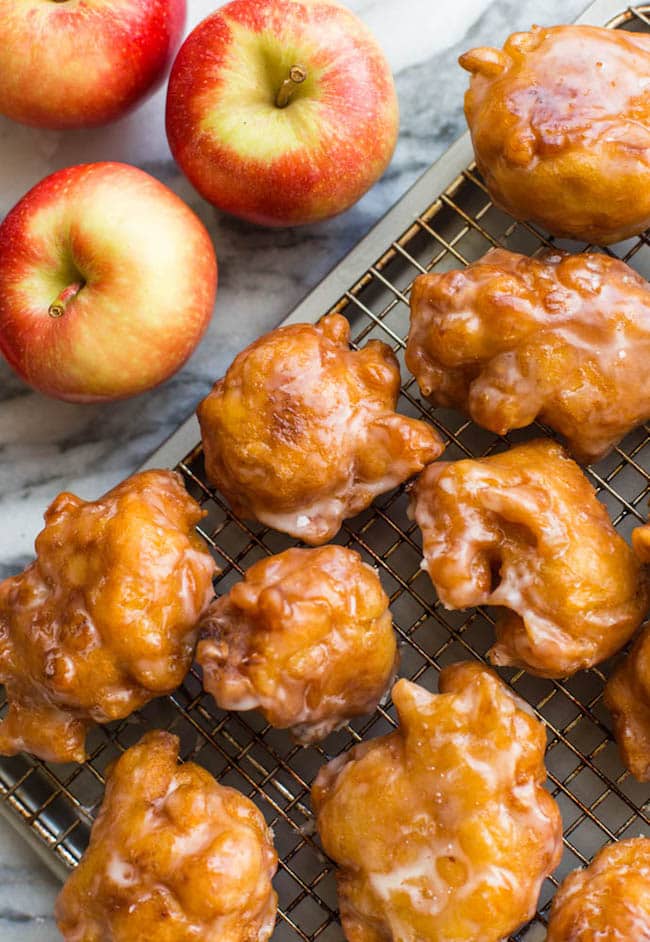 Gluten Free Apple Fritters cooling a wire rack with apples