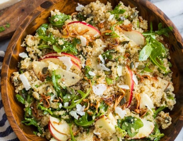 Honey Mustard Quinoa Apple Salad with Crispy Shallots mixed in a wooden bowl
