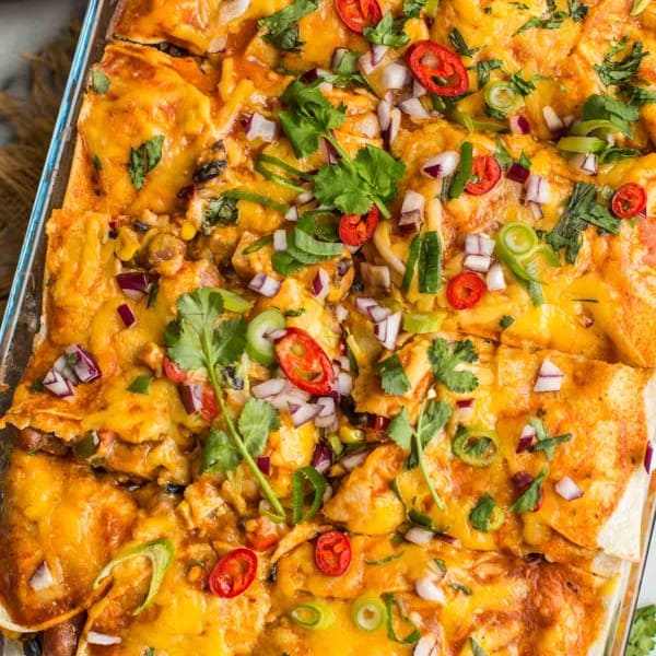 Black-Bean-Butternut-Squash-Enchilada-Casserole topped with cilantro, onion, and chilies