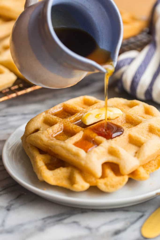 syrup pouring over Almond Flour Waffles