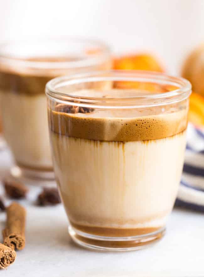 Whipped Pumpkin Spice Coffee in a see through glass mug