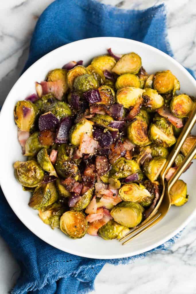 Roasted Maple Bacon Brussels Sprouts in a white serving bowl