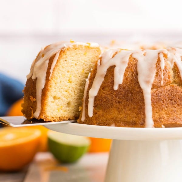 spatula picking up Zesty-Orange-Drizzle-Cake-