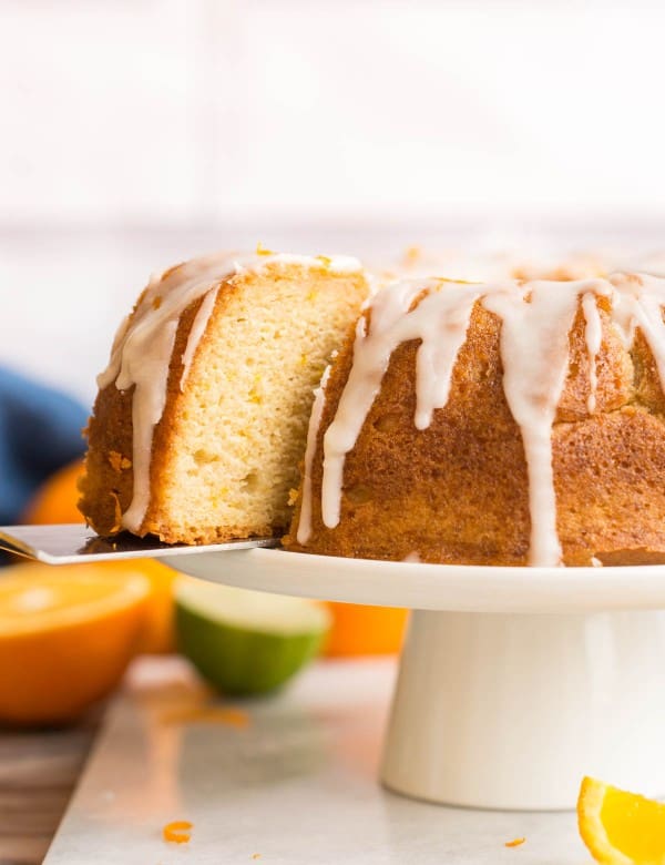 spatula picking up Zesty-Orange-Drizzle-Cake-