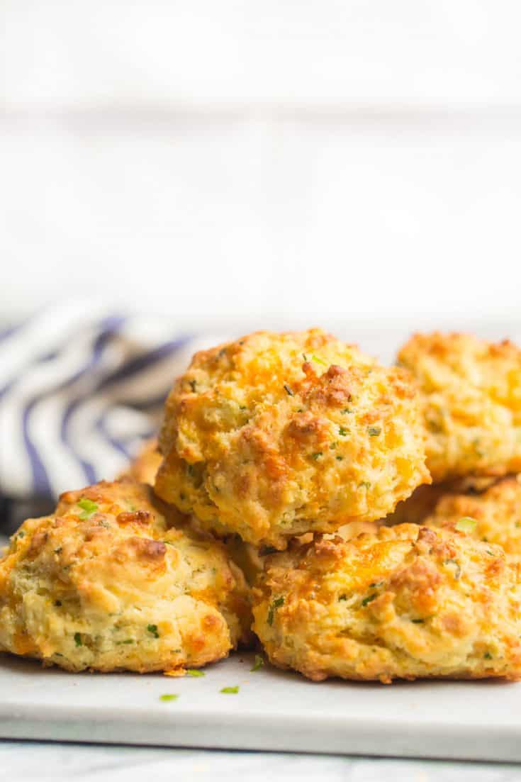 cheesy gluten free biscuit piled on a platter
