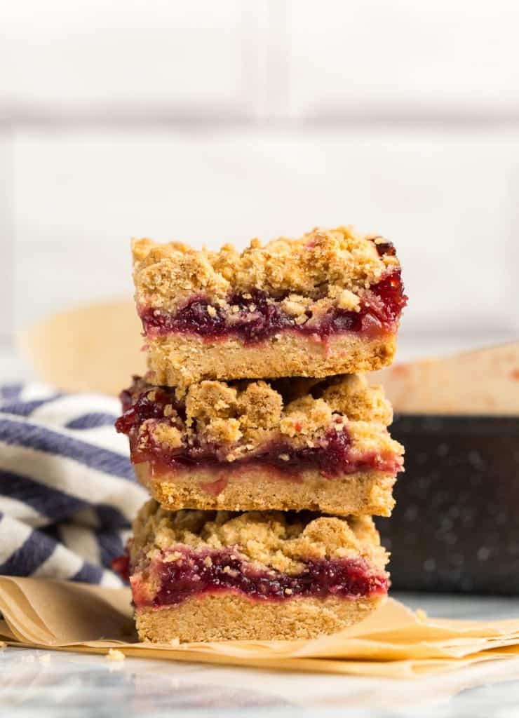 three Gluten Free Cranberry Crumble Bars stacked