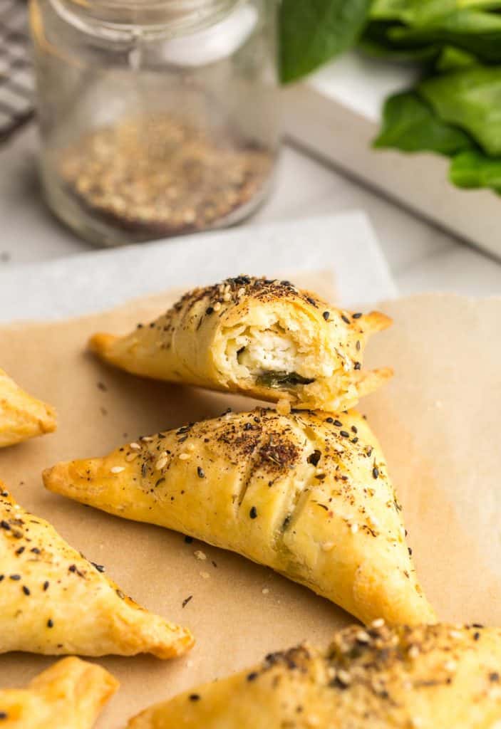 up close Gluten Free Spinach & Feta Parcels with a bite taken out