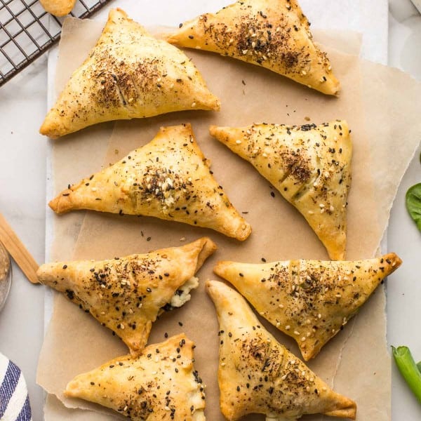 Gluten Free Spinach & Feta Parcels on a sheet of baking paper