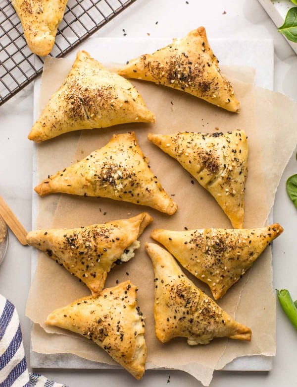 Gluten Free Spinach & Feta Parcels on a sheet of baking paper