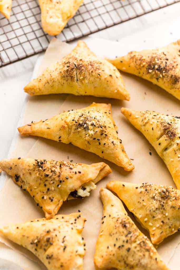 Gluten Free Spinach & Feta Parcels cooling on a cutting board