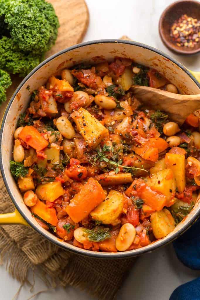 Roasted Root Vegetable Stew in a yellow cooking pot