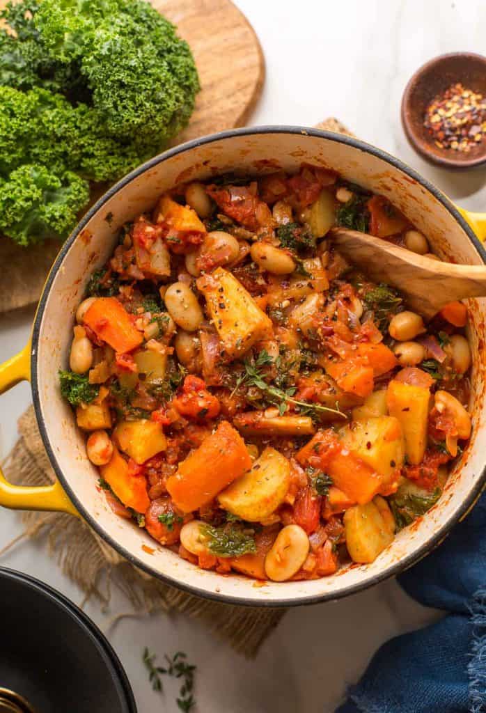 Roasted Root Vegetable Stew in a big yellow cooking pot