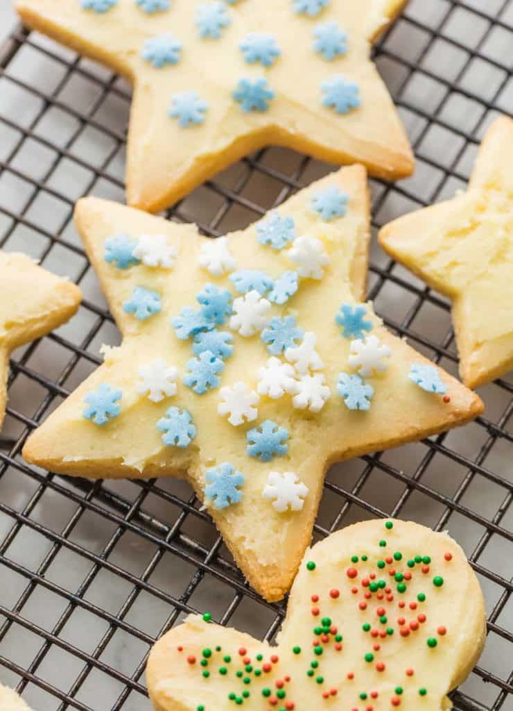 Almond Flour Sugar Cookies frosted with snowflake sprinkles