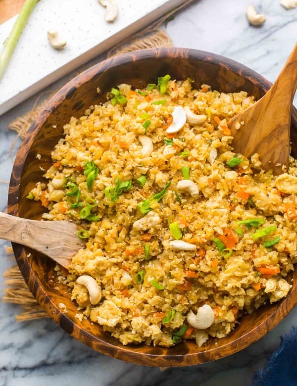 Cauliflower Egg Fried Rice in a wooden serving bowl