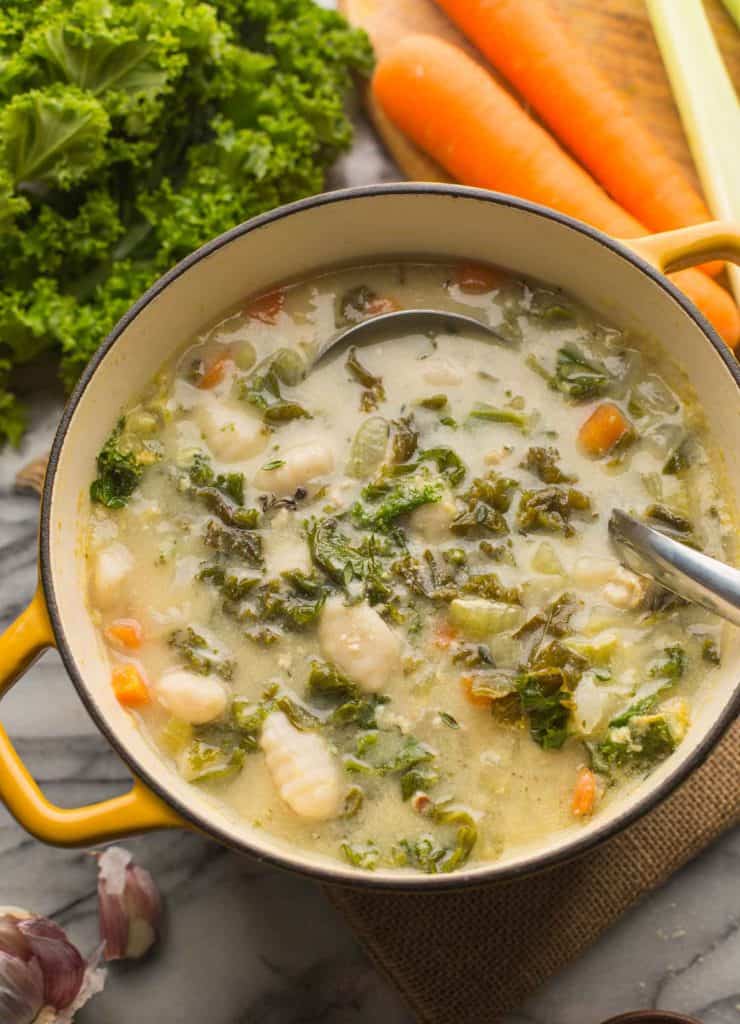 Creamy Chicken Gnocchi Soup in a big yellow soup pot